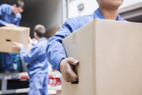 Moving team preparing equipment safely before a house move