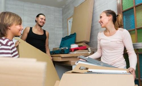 Furniture being carried carefully through a South Kensington townhouse