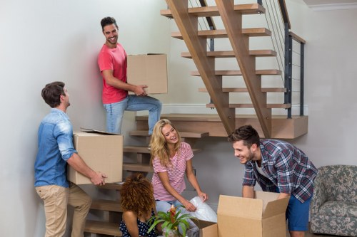 Moving boxes and furniture being loaded for a South Kensington flat move