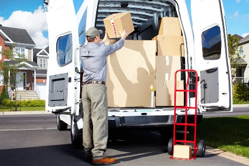 Worker using proper lifting technique during relocation