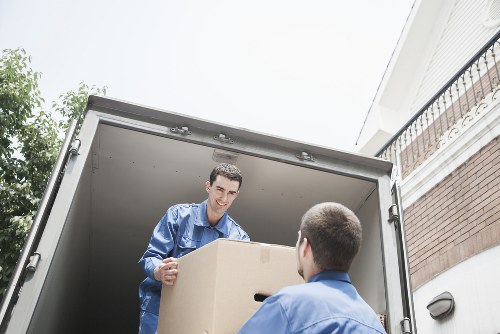 Quoted moving costs shown beside a van outside a South Kensington apartment building